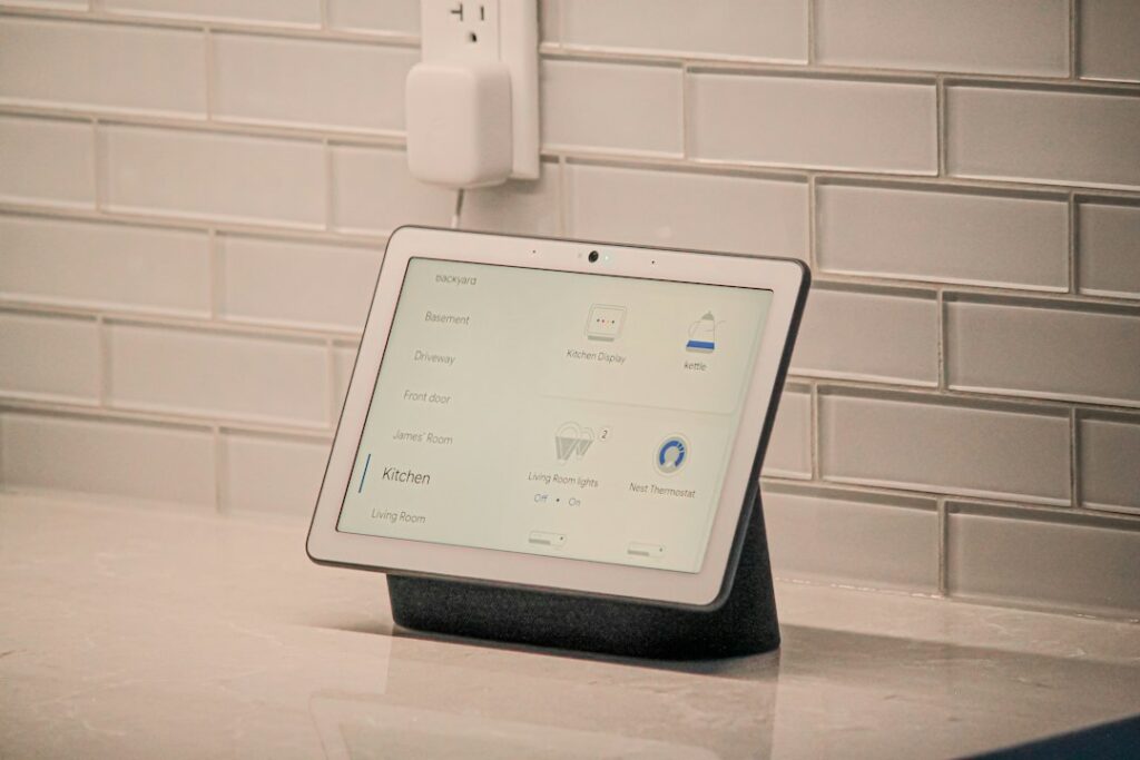 Residents use a smartphone to adjust connected lights while sensors and a thermostat operate in a living room.