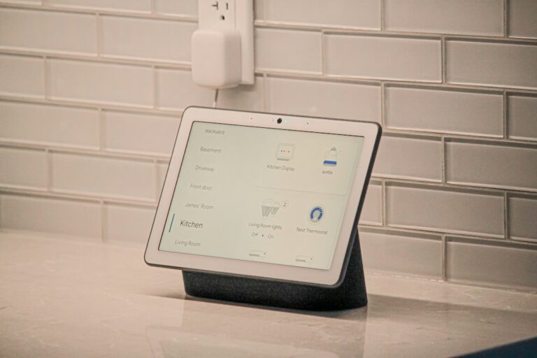 Residents use a smartphone to adjust connected lights while sensors and a thermostat operate in a living room.